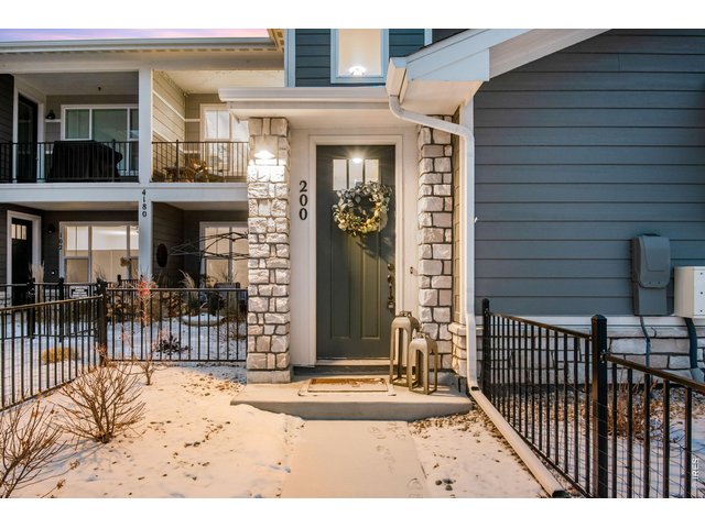 Property Photo 27 Covered front porch, stone pillars, LVP foyer and coat closet then up the stairs to a huge single level at 1,535 finished and 1,653 total finished.