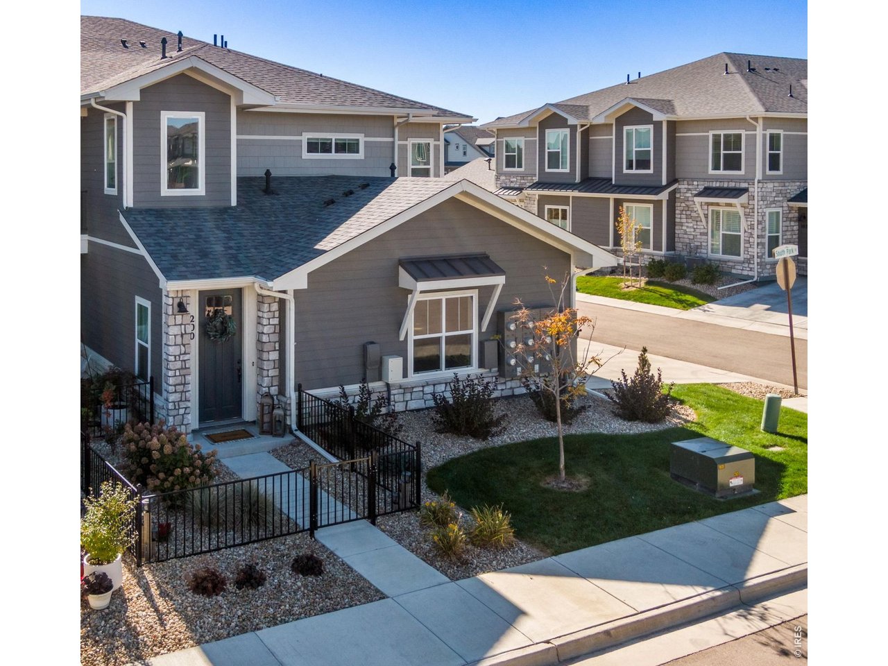 Enclosed front yard area. On the Corner - super low to no maintence raised ranch.