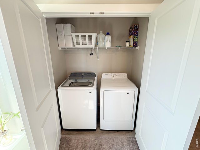 Property Photo 13 Laundry room upstairs adjacent to master bath.