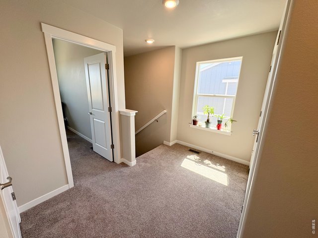 Property Photo 17 Upstairs hallway, lots of natural light.