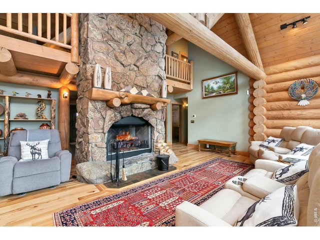 Property Photo 2 Floor to Ceiling Moss Rock Fireplace