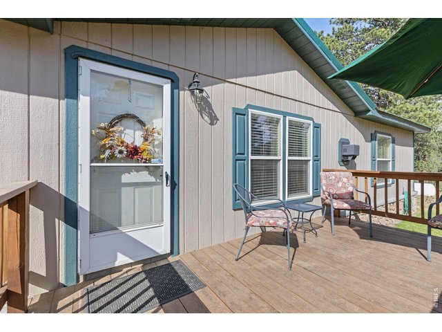 Property Photo 4 Entry off the front deck - a perfect place to watch the wildlife while you sip your morning coffee. 