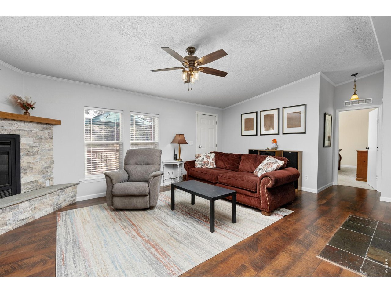 Enter into this bright and tastefully updated Living Room with nearly new Pergo flooring! 