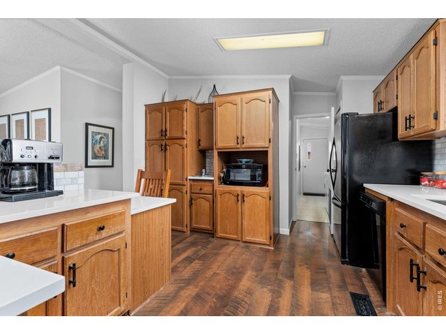 Property Photo 8 Kitchen has upgraded quartz countertops and marble tile backsplash. 