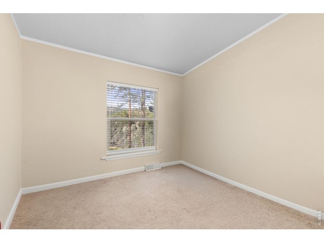 Property Photo 18 Third/spare bedroom - currently being used just for storage. 
