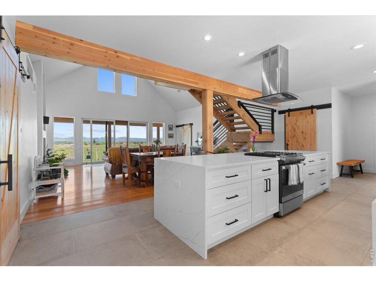 Soft close drawers, pull out trash and recycle, front patio access and stainless-steel appliances which includes a gas range with flat grill are all included