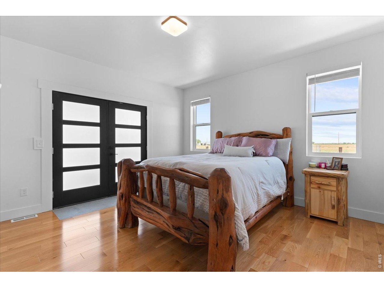 Primary suite with retreat features a barn door,
