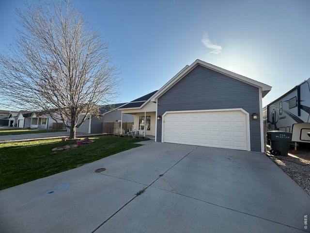 Property Photo 24 Exterior Front Side/Garage View