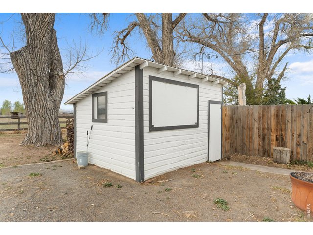 Property Photo 38 This shed features a TV behind the dropdown window for outdoor entertainment