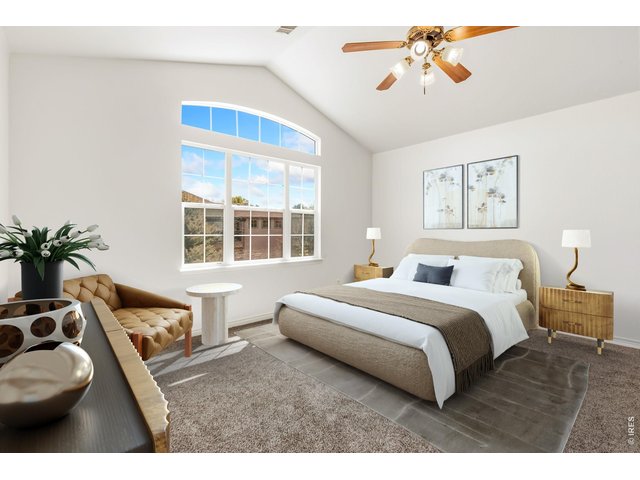 Property Photo 18 Huge primary bedroom with vaulted ceilings