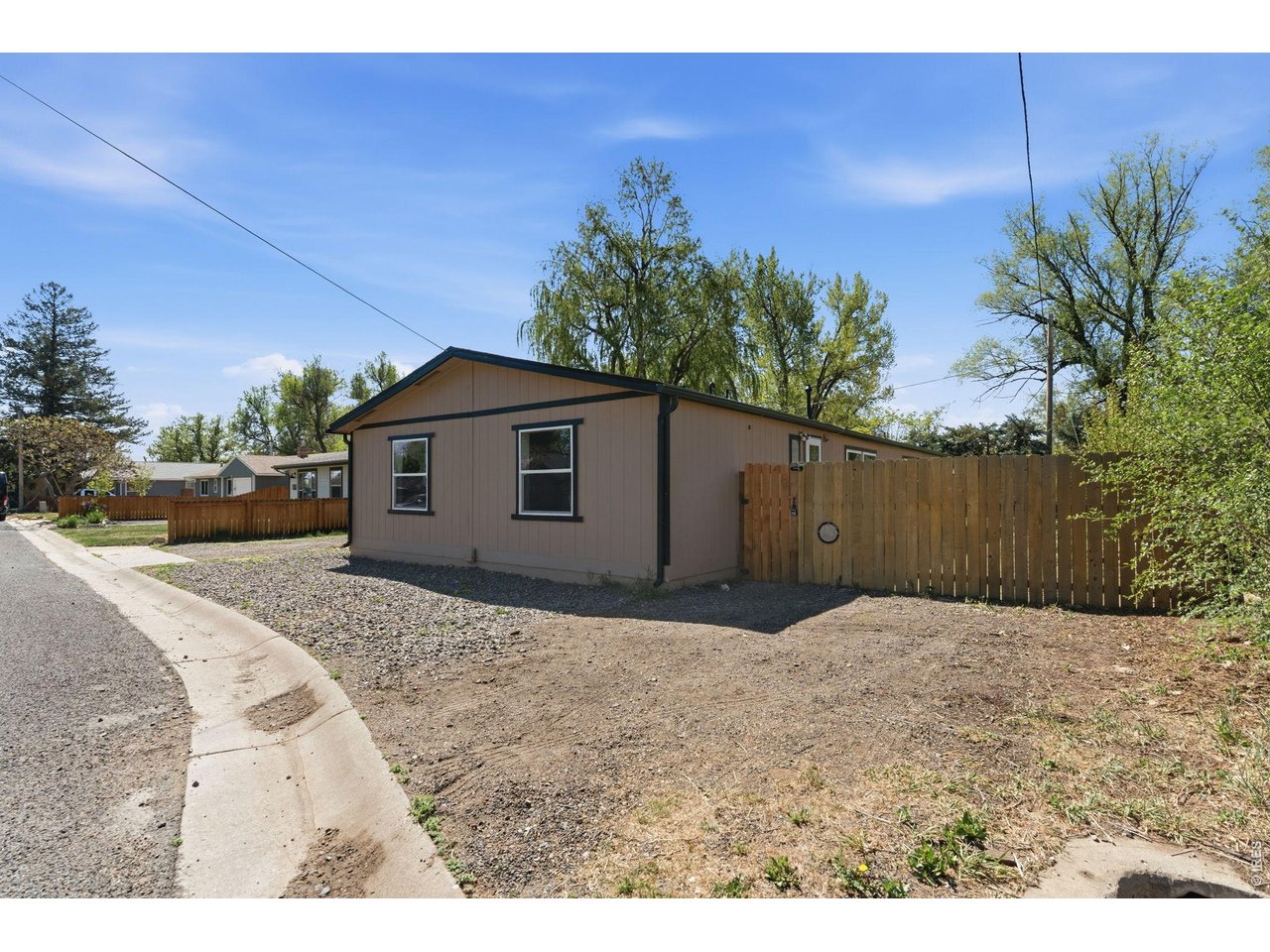 Additional parking on west side of house and access gate to 2 bedroom side.