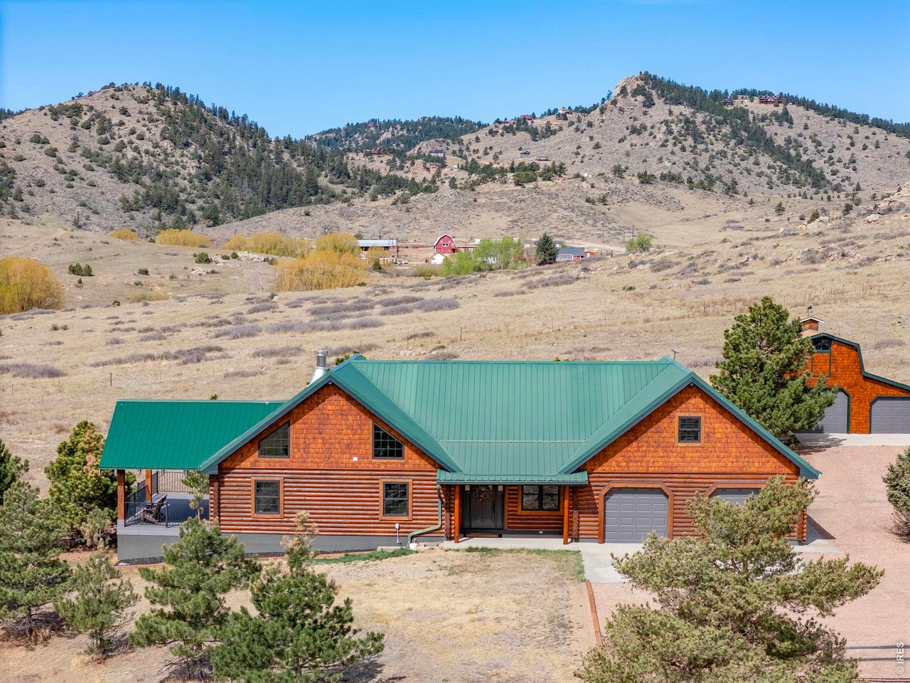 The log home features 3 bedrooms, 4 bathrooms plus a large loft space, home office, and more!