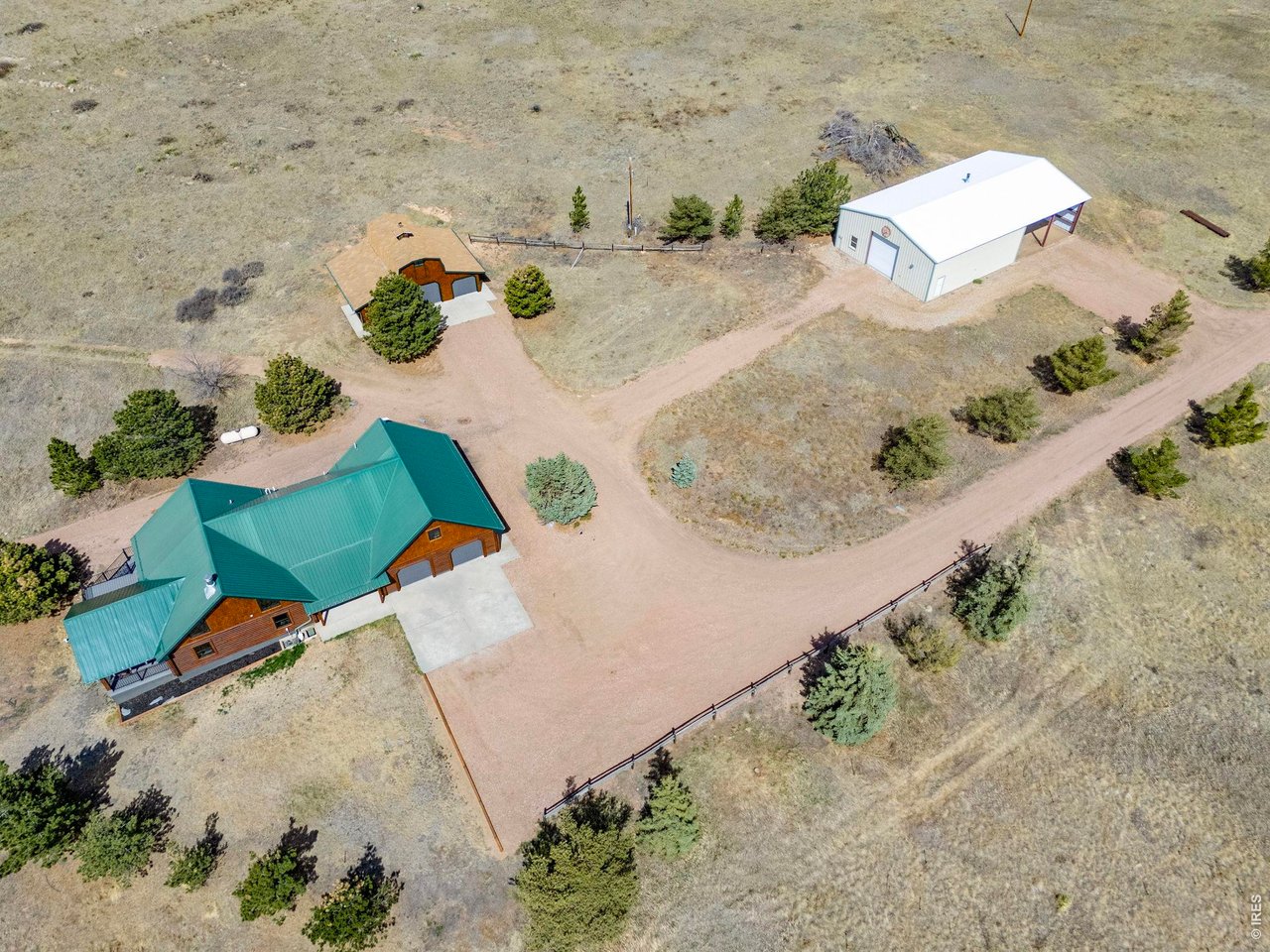 This property features a 3,888 sq ft updated log home with 2 car attached and 2 car detached garages as well as a large 40'x40' outbuilding which includes 30'x40' of additional covered storage.