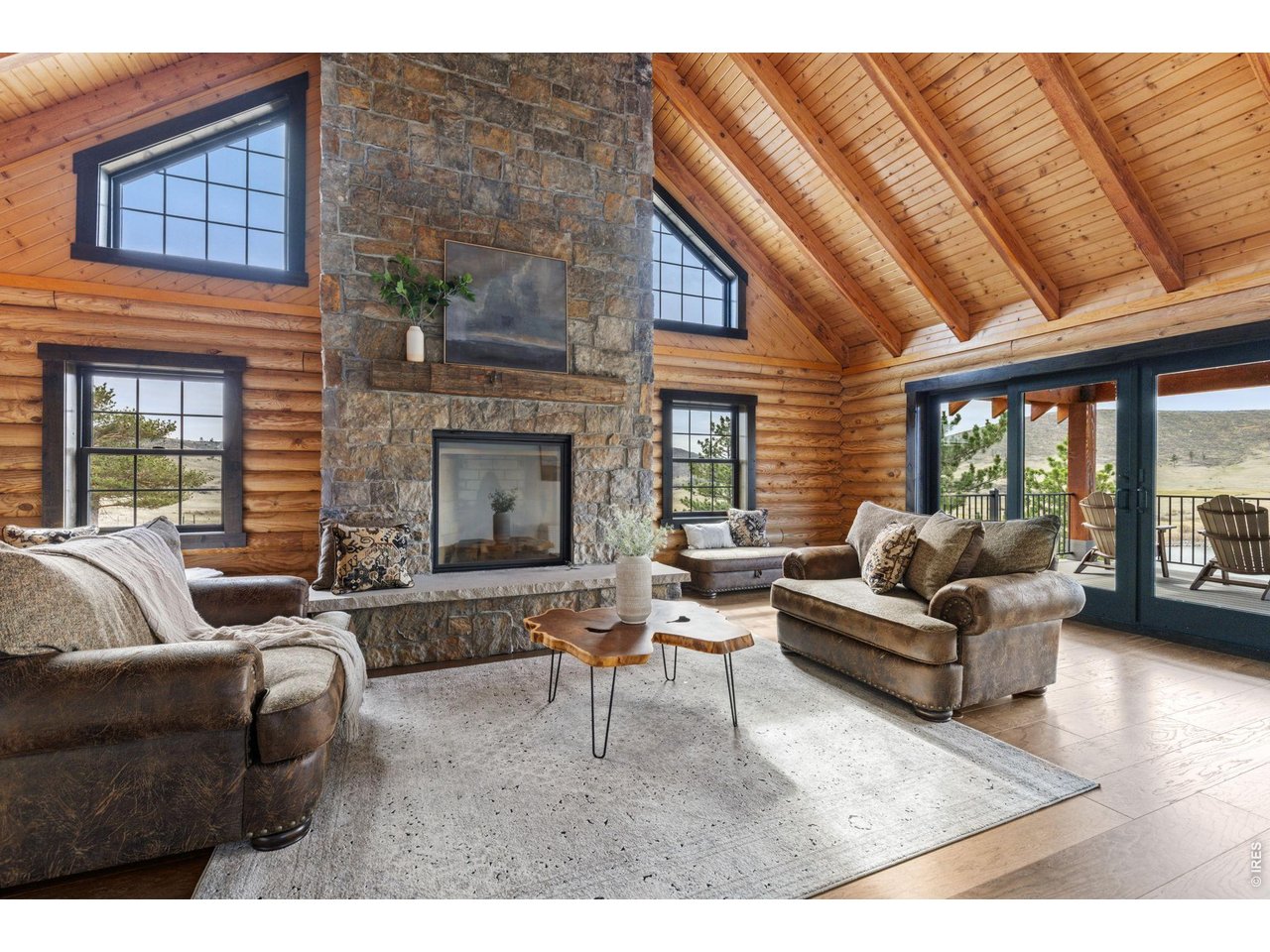The fireplace is the focal point of this bright open room. 