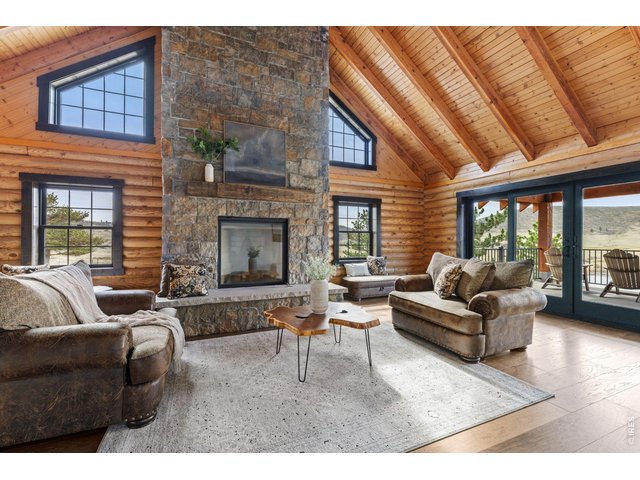 Property Photo 10 The fireplace is the focal point of this bright open room. 