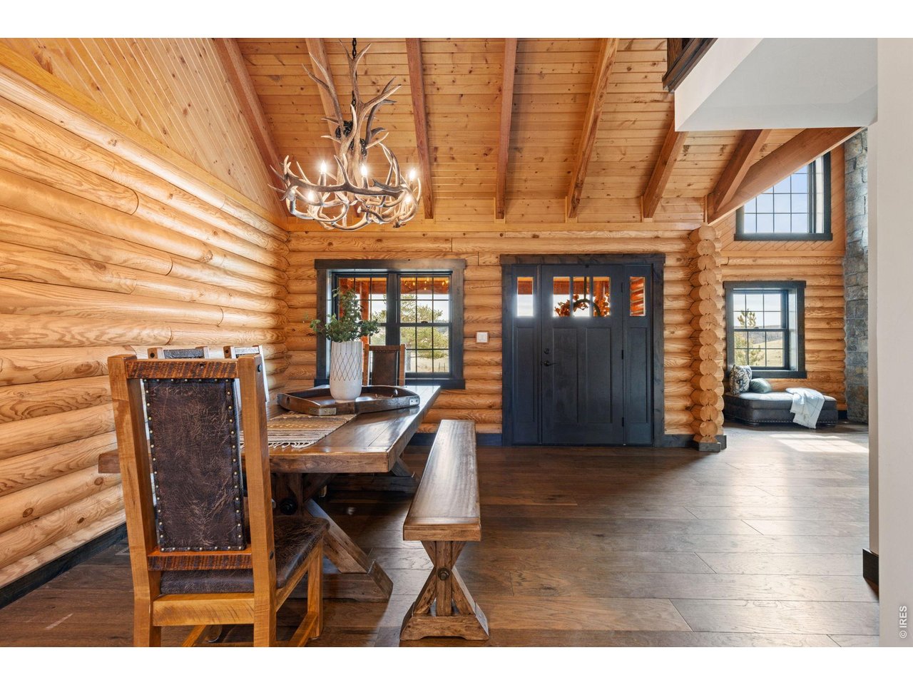 Moving the other direction from the front entry enters into the open Dining and Kitchen area.