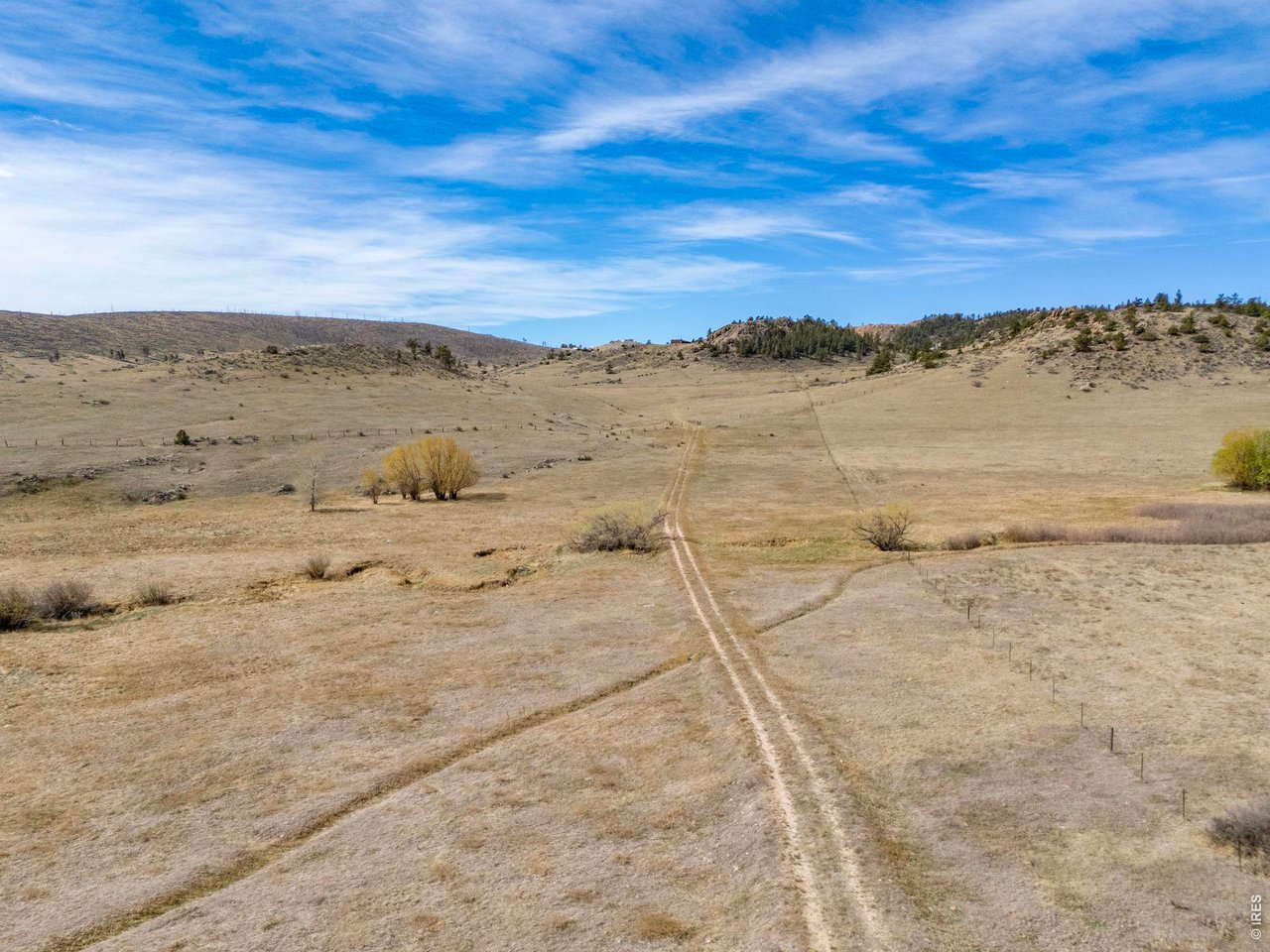 Two-track continues through property to access the back acreage as well as National Forest Access. 