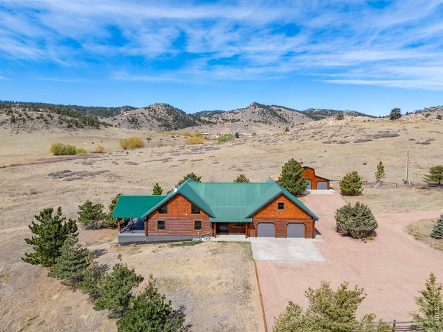 Property Photo 1 Welcome to 11881 W County Road 74E! An incredible 145 acre property backing to 1,000s of acres of National Forest! 