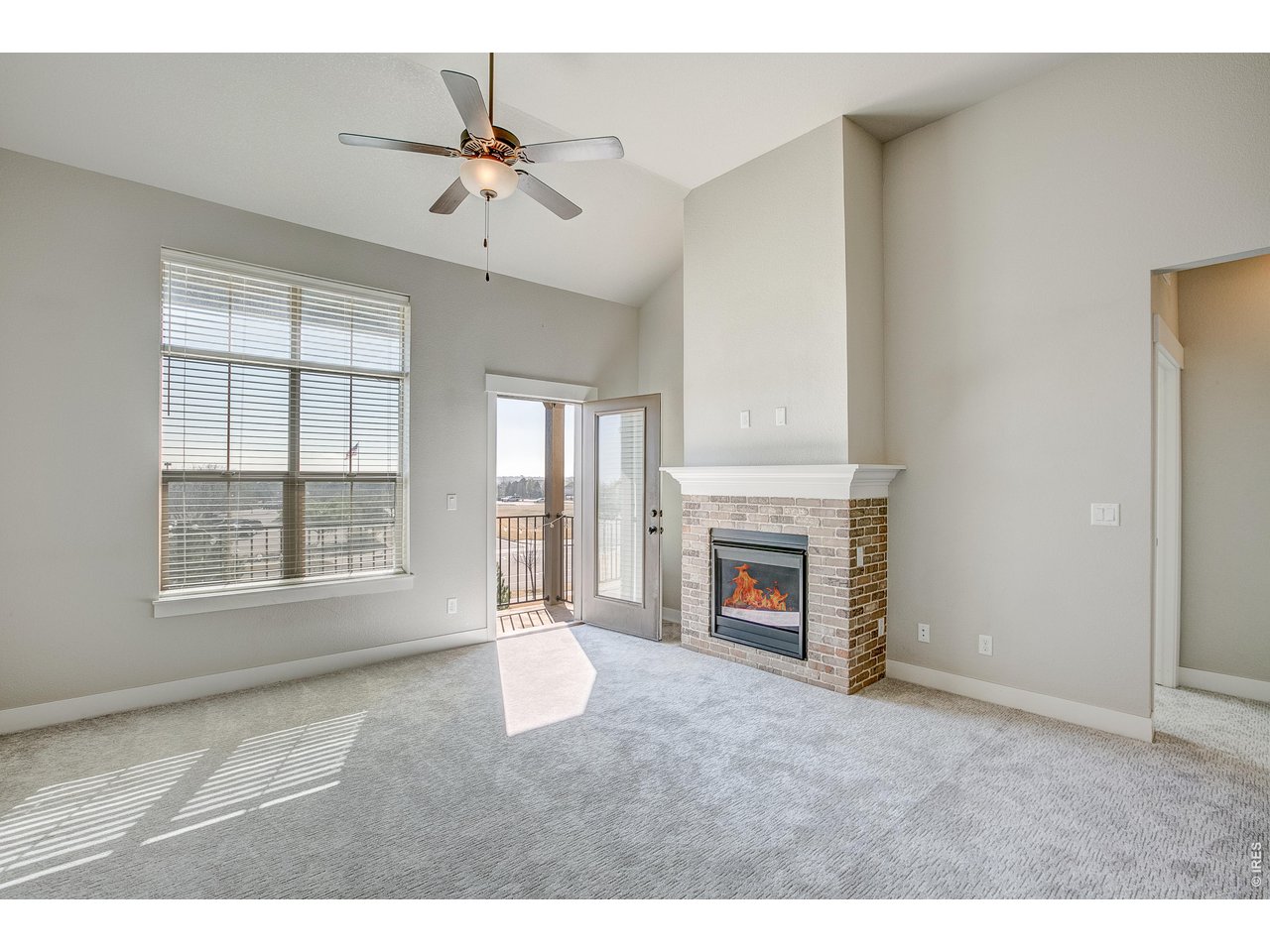 Property Photo 13 Vaulted ceilings w/ ceiling fan & gas fireplace.
