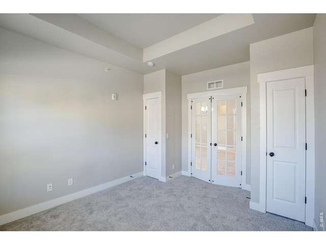 Property Photo 21 Interior of study/3rd bedroom with two closets. 