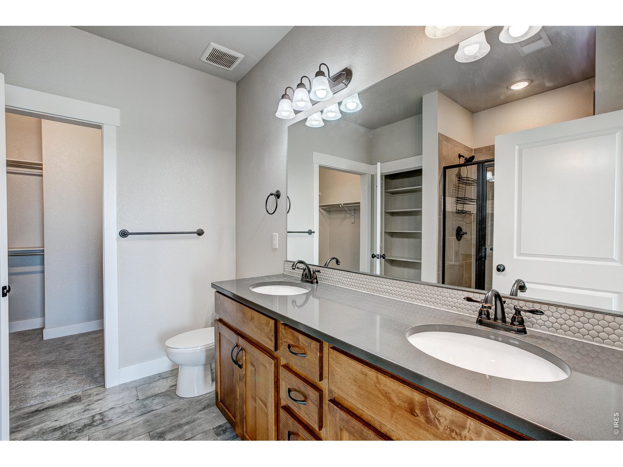 Property Photo 27 Primary bathroom with dual vanities.