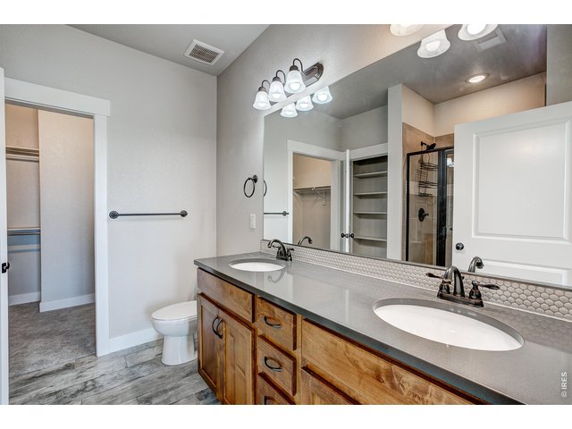 Property Photo 27 Primary bathroom with dual vanities.