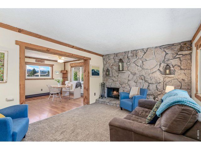 Property Photo 2 Wood Burning Living Room Fireplace with a newly painted rock surround