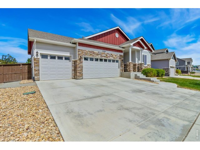 Property Photo 4 South facing driveway for easy snow melt. 3-car garage with storage racks included!