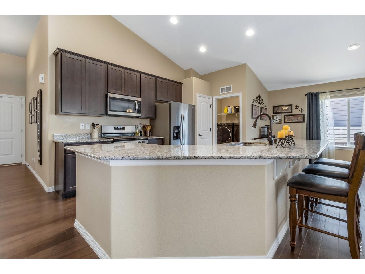 Entryway leads into Kitchen and Living Room. Note the Laundry Room which leads to the garage.