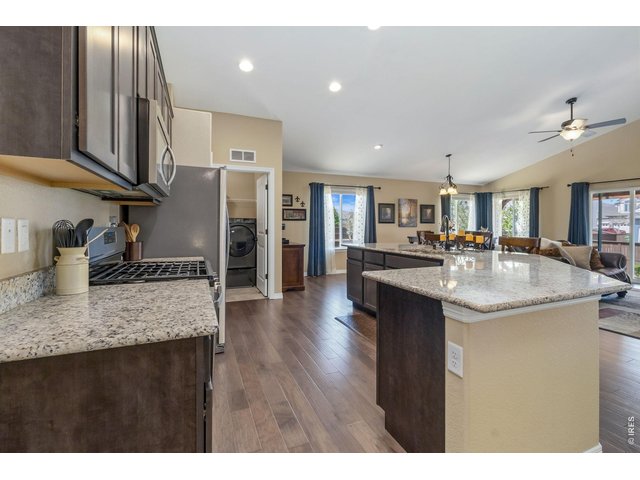 Property Photo 5 This property boasts a gorgeous, open floorplan perfectly designed to accommodate the needs and desires of modern living, offering both style and functionality.