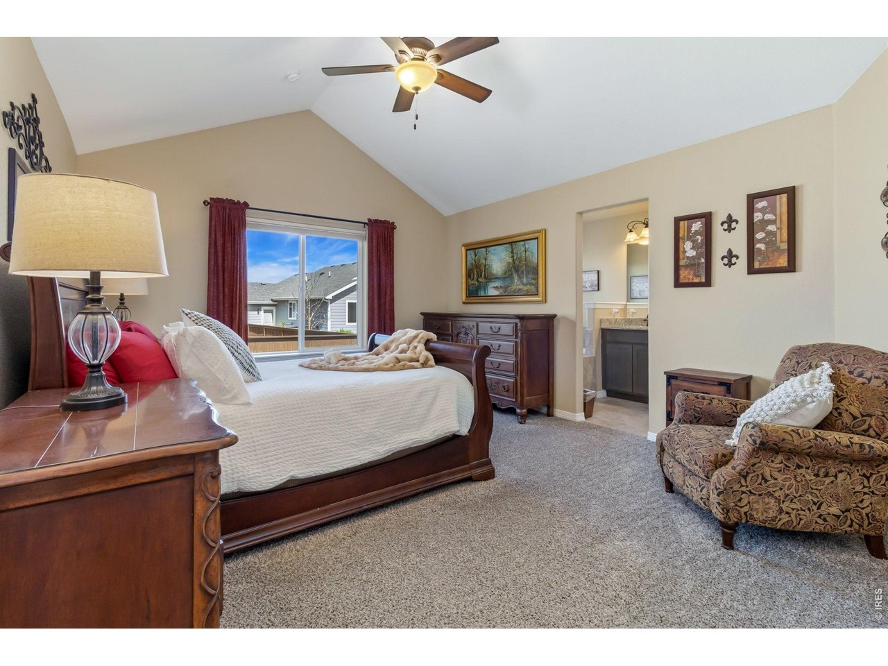 Primary Bedroom with vaulted ceiling.
