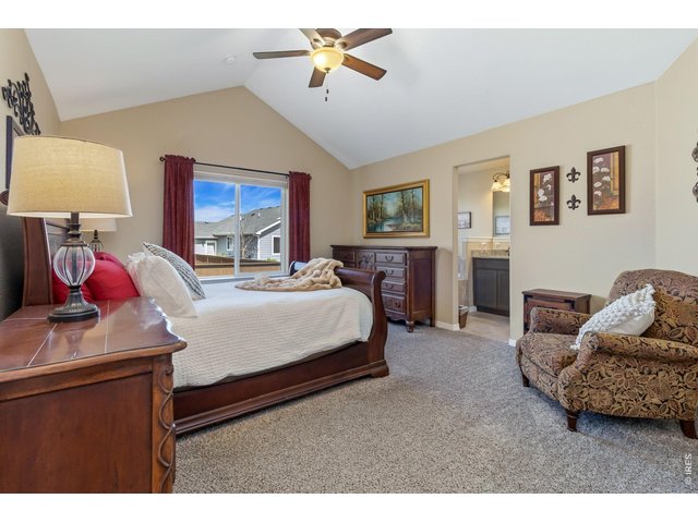 Property Photo 16 Primary Bedroom with vaulted ceiling.
