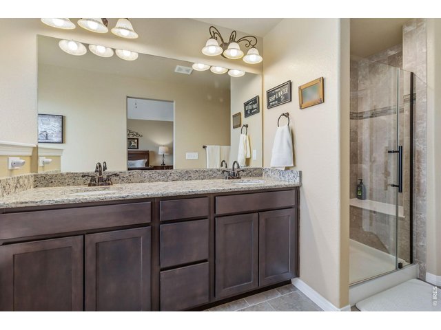 Property Photo 18 Primary Bathroom with Double Vanity, Walk-in Shower, Deep Soaker Tub, Separate Toilet Room and Walk-in Closet