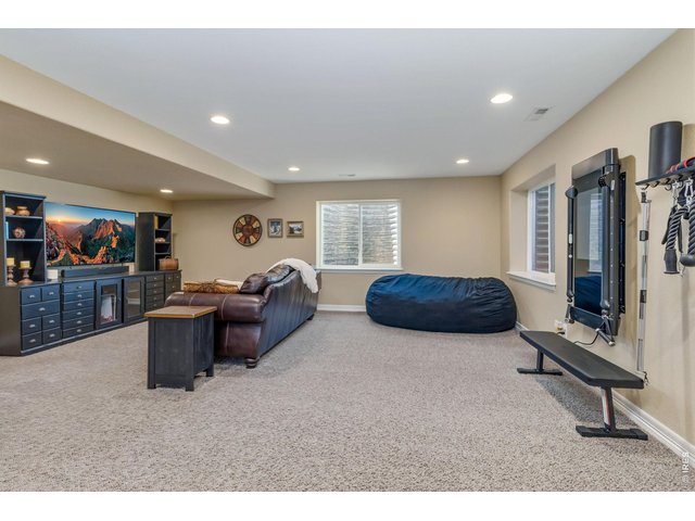 Property Photo 25 This space is perfect for family fun and entertainment, offering a versatile area for relaxation and activities.