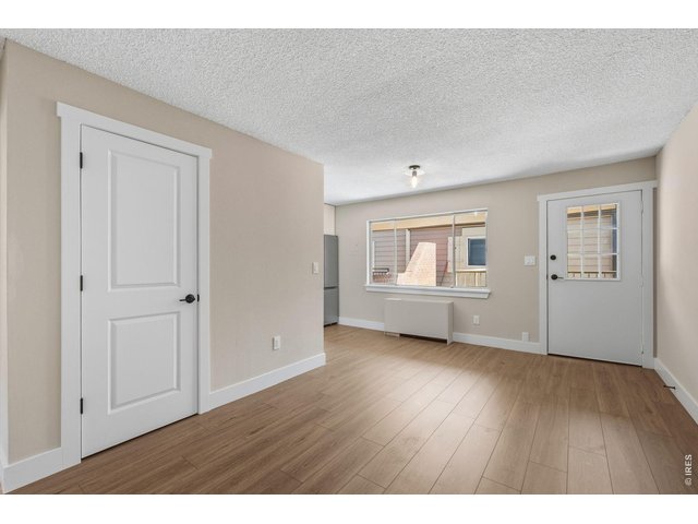 Property Photo 6 2026 two panel doors and matte black Schlage hardware throughout
