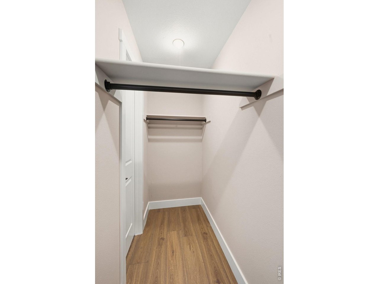 Walk-in closet with matte black rods