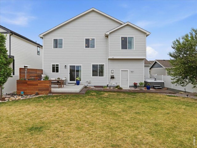 Property Photo 48 Rear Of Two Story Home With Patio