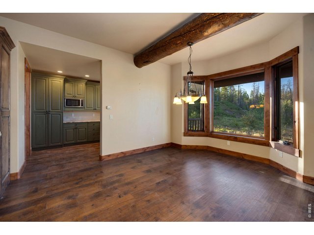 Property Photo 11 View of the breakfast dining area, with large windows, leading to second prep kitchen 