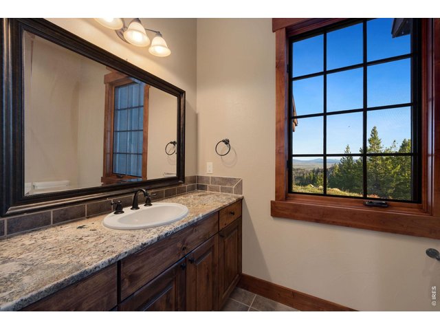 Property Photo 21 More natural light from additional bathroom fostering views of the peaks to the south