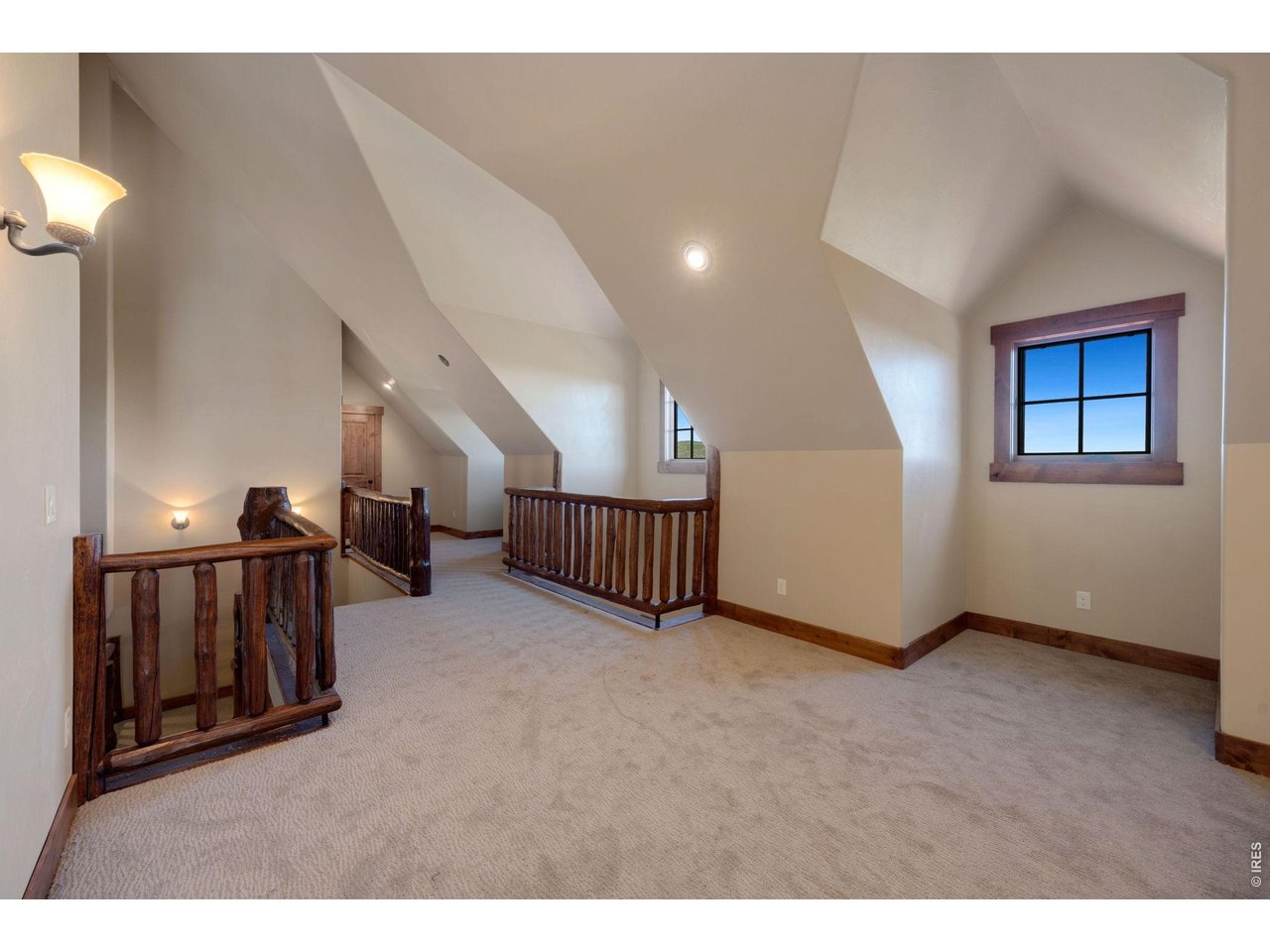 Vaulted windows to carry forward more natural light and log railing to tie it all together