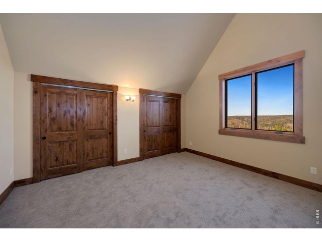 Property Photo 26 Large second bedroom on top floor complete with attached private bathroom