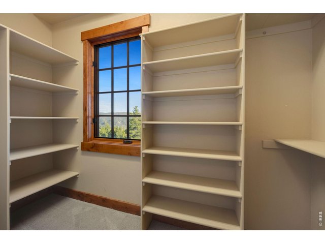 Property Photo 19 View inside of walk-in closet with views of the peaks to the east