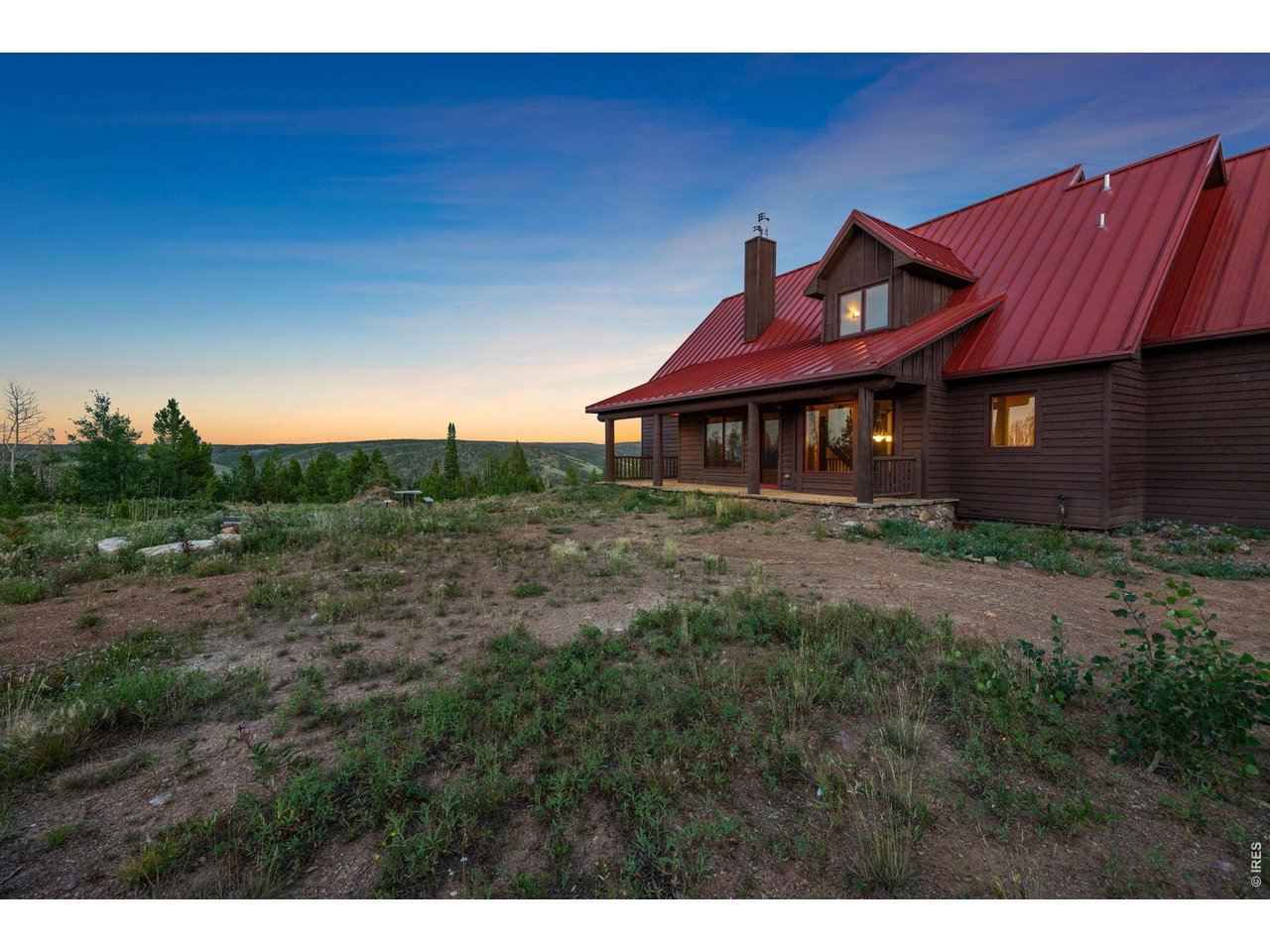 Back porch of cabin and fire pit area