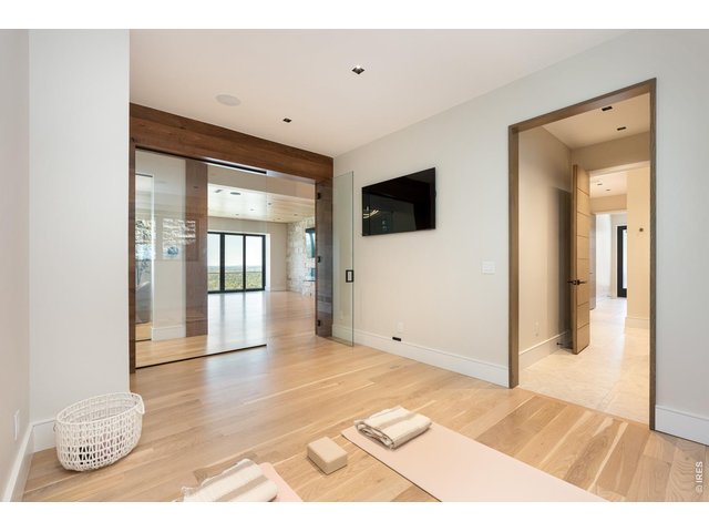 Property Photo 41 Main level wellness studio and spa. A designated exercise studio with access to full bath room, sauna and shower. 
