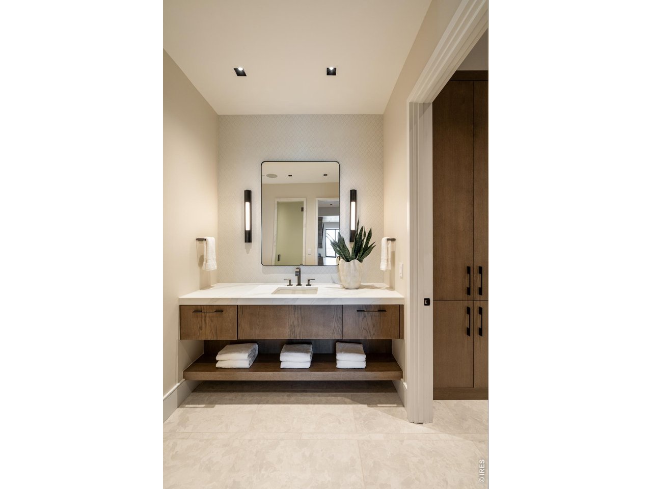 The first-floor spa area features a sauna with a backlit wall of Himalayan pink salt, steam shower, changing room, water closet, and workout room.