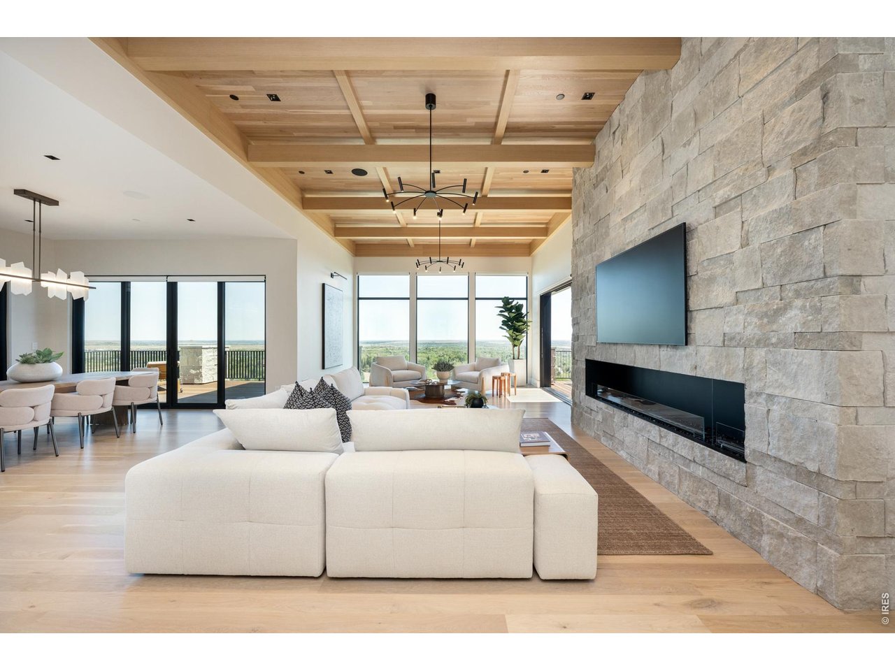 Open concept living creates a seamless flow for hosting and entertaining. Multiple fine art gallery lights throughout the home are perfect for the dedicated art collector.