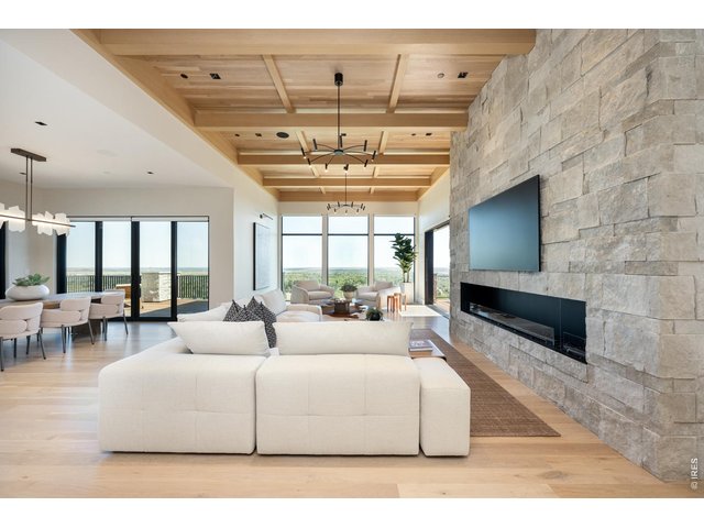 Property Photo 16 Open concept living creates a seamless flow for hosting and entertaining. Multiple fine art gallery lights throughout the home are perfect for the dedicated art collector.