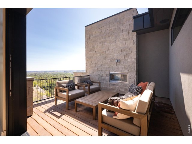 Property Photo 19 Private balcony with outdoor EcoSmart gas fireplace. 