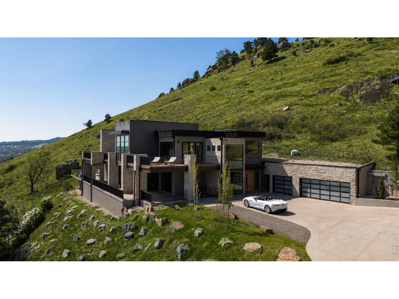 Perched above Boulder in the coveted Pine Brook Hills enclave, this private, resort-style retreat redefines elevated mountain living-where luxury, wellness, and breathtaking natural beauty converge just minutes from downtown. *Grass enhanced with AI