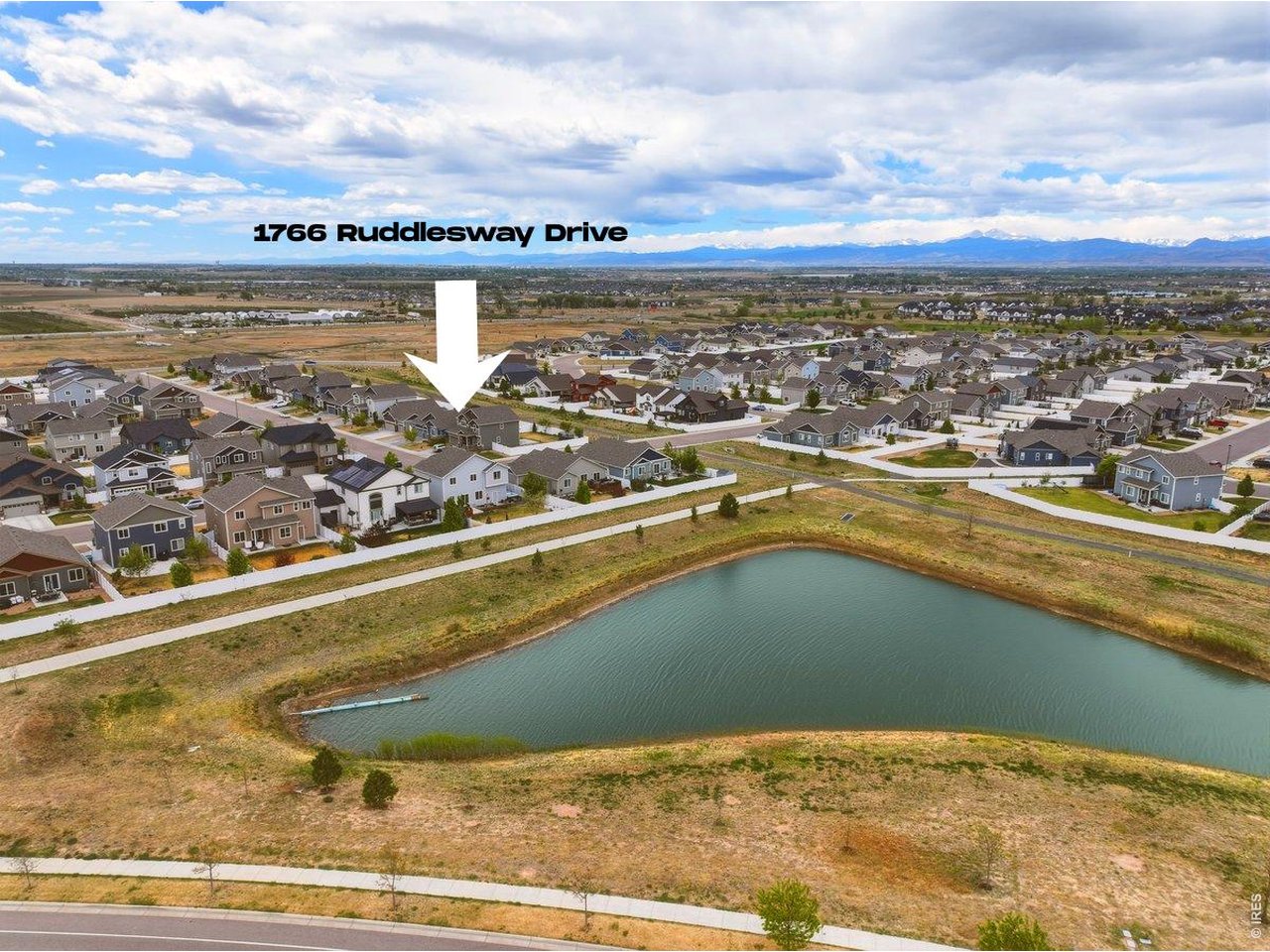Aerial View With Open Space and Retention Pond Behind Property